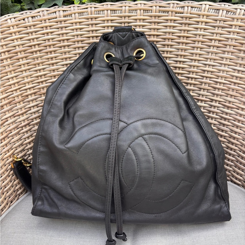 Authentic CHANEL black lambskin leather drawstring backpack bag